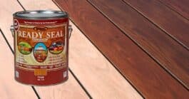 Can of READY SEAL deck stain-and-sealer in one shown against stained wood deck boards in various finish stages